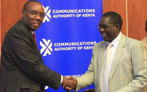 Kenya National Bureau of Statistics (KNBS) Director General Mr.Zachary Mwangi (left) and his Communications Authority of Kenya (CA) counterpart Mr.Francis Wangusi at the launch of the National ICT Survey.