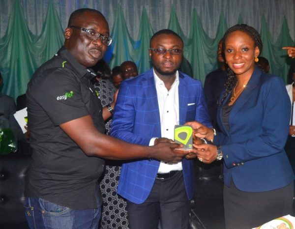Calabar- Mohammed and Oyetola presenting a gift to Asu Okang Commissioner for Youths and Sports River State First Lady