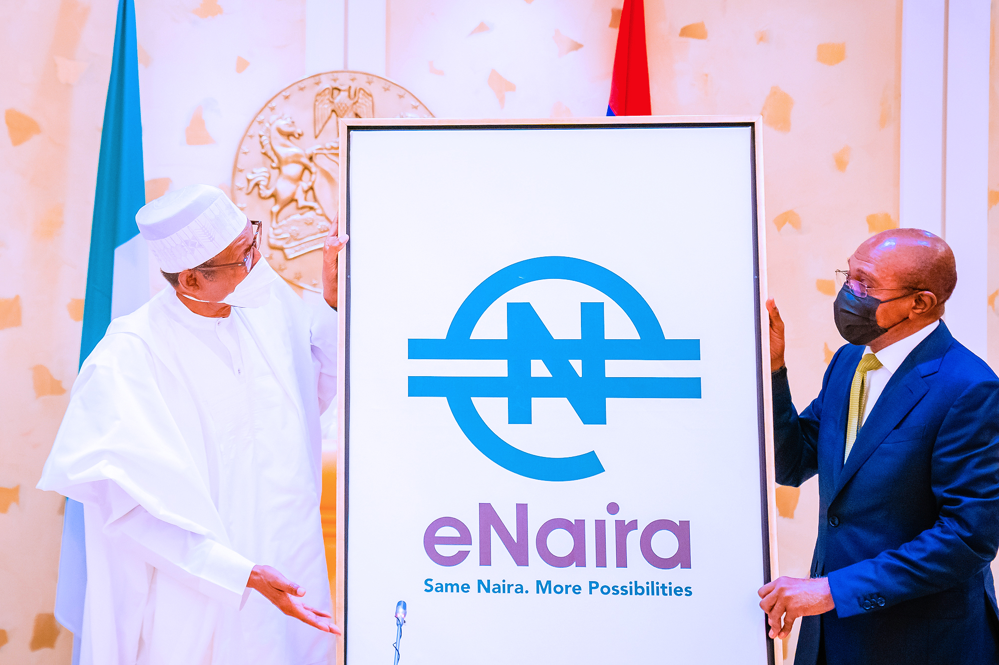 President Muhammadu Buhari (left) and CBN Governor, Godwin Emefiele, during the launch of Nigeria's digital currency, the eNaira, on Monday.