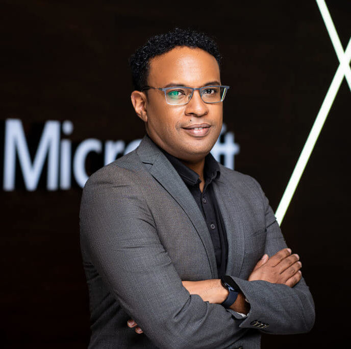 Jack Ngare in front of Microsoft's logo