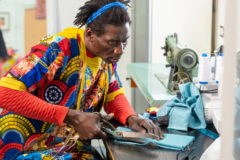 A Senegalese tailor works from his workshop. Photo credit: iStock by Getty Images