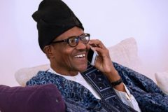 A picture of Nigerian President Muhammadu Buhari making a phone call