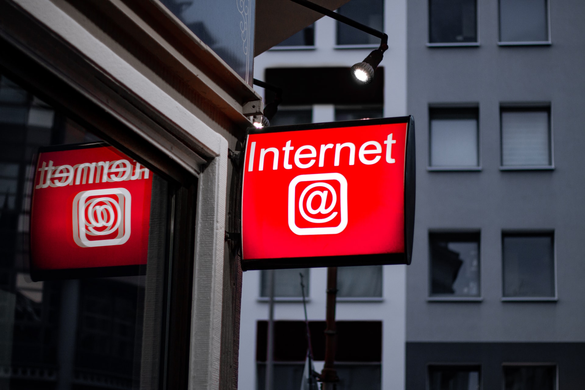 A lighted signboard with the word "Internet" and the symbol @
