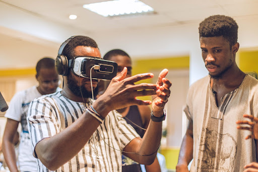 Team LeVRn using a VR headset at a VR hackathon in 2016