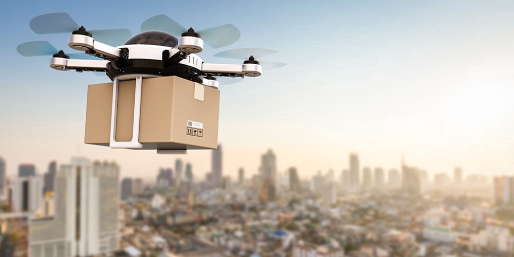 A delivery drone hovering over a modern cityscape