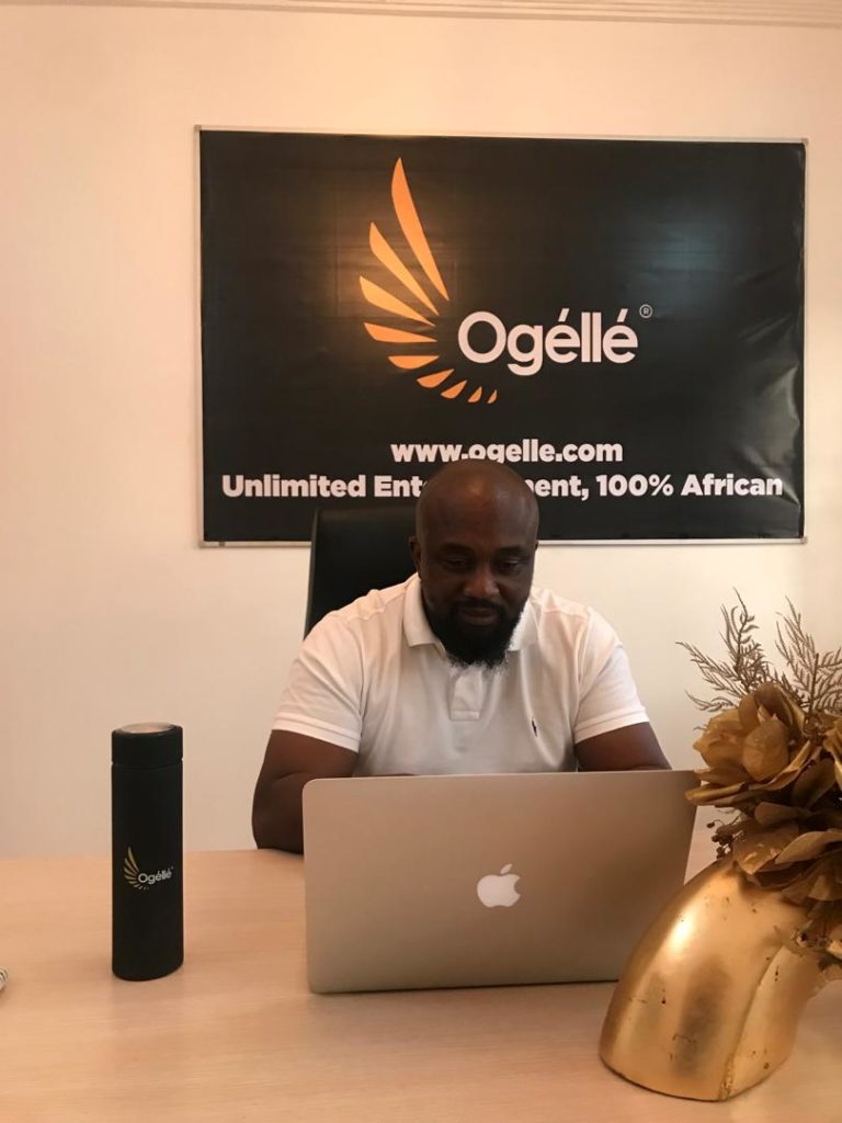 Osita Oparaugo at his desk building Ogelle
