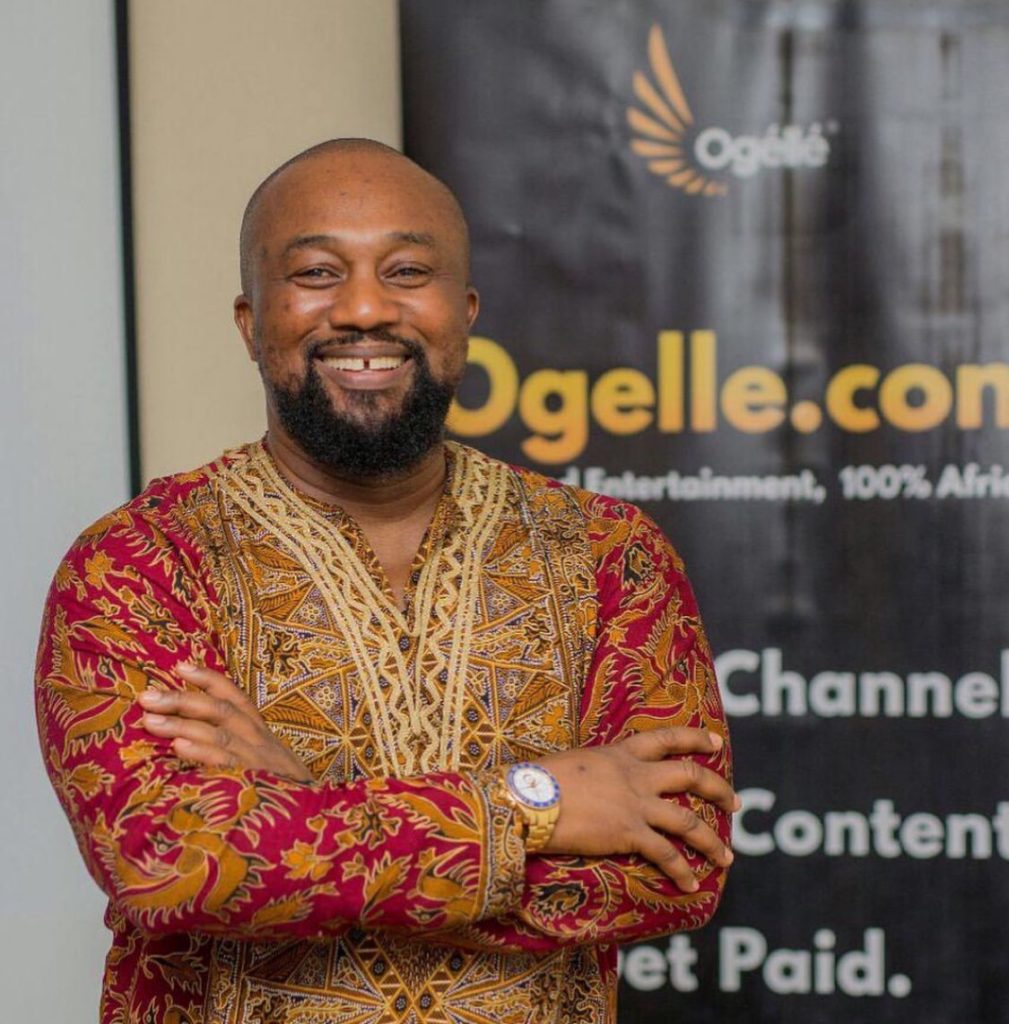 Osita Oparaugo smiling and facing the camera