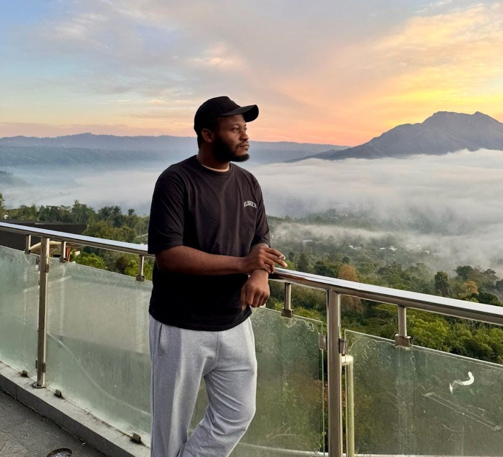 Ayodeji above the clouds at Kintamani, Bali, Indonesia